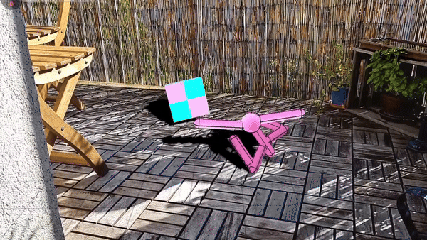 Ansicht eines Balkonbodens in Augmented Reality. Eine 3D Figur läuft auf bunte Würfel zu, die in den Raum geworfen werden.